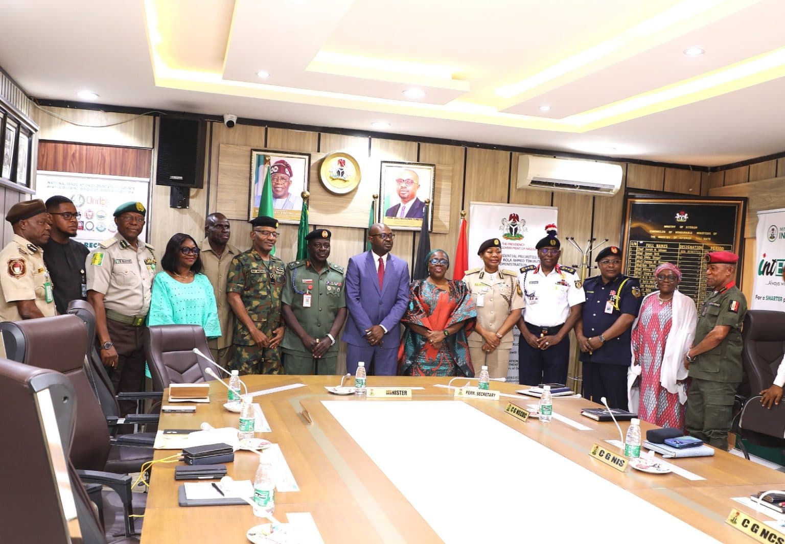 The Minister of Interior with the AFRIDEX delegation and service chiefs in his office in Abuja.